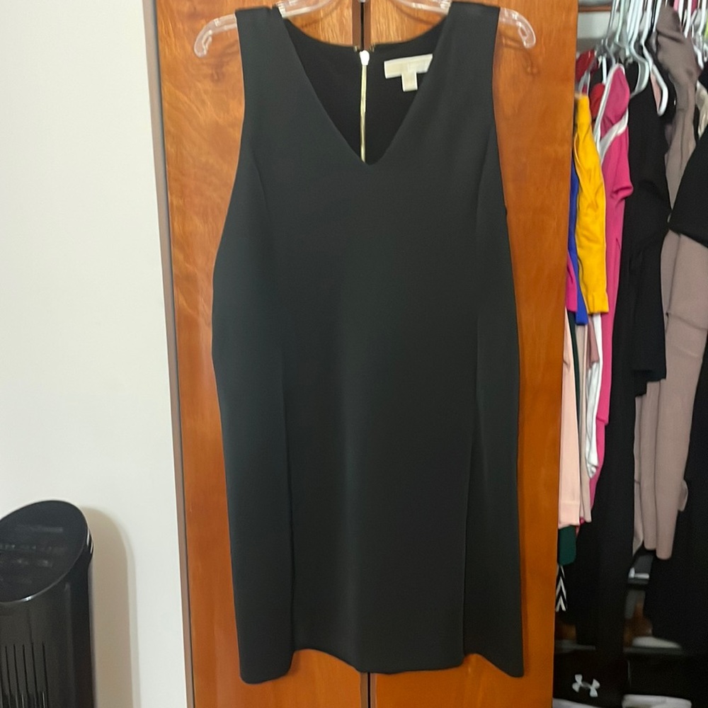 Black, stretchy midi length no tags but never worn Michael Kors dress